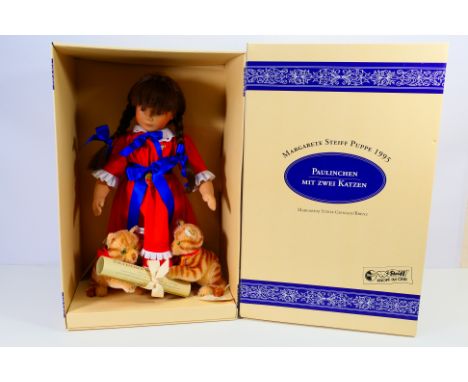 Steiff - Unused stock. A 1995 boxed Steiff 'Paulinchen with two cats' The doll and cats are fastened within the original box 