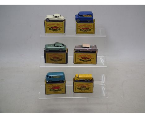 Matchbox - Lesney - A group of boxed models including VW van # 34, Cadillac # 27, Aston Martin # 53 and others. They show som