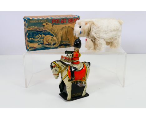 T.T.T. - 2 x vintage clockwork models, a boxed Polar Bear with cub and fish, made in Japan. The model appears in Very Good wo
