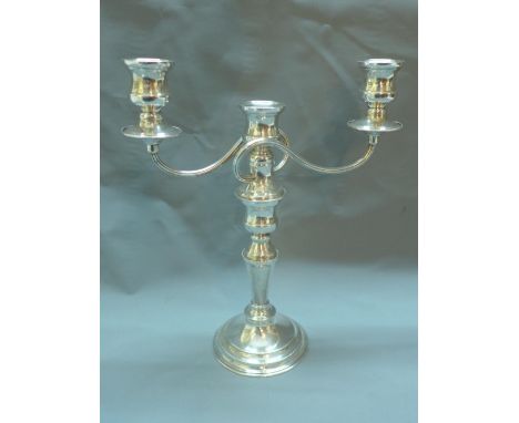 A silver plated two branch candelabra, by G.A. Baker, H.33cm 