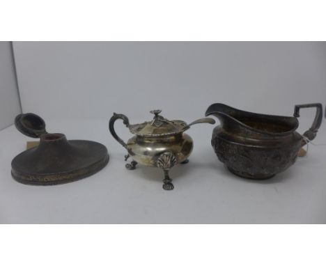 A Georgian silver jug, repousse embossed, hallmarked London, maker William Burwash, L.15cm, together with an early Victorian 