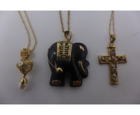 A black Jade yellow gold pendant in the form of an elephant, stamped 14k on a fine gold chain, marked 9ct together with a Bro