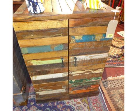 A distressed painted Indian drinks cabinet with two doors revealing a shelf and wine rack, H.88 W.61 D.46cm 