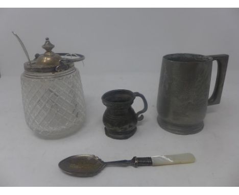 A cut glass sucrier with silver collar, swing handle and lid, hallmarked London, together with a silver fiddle pattern spoon,