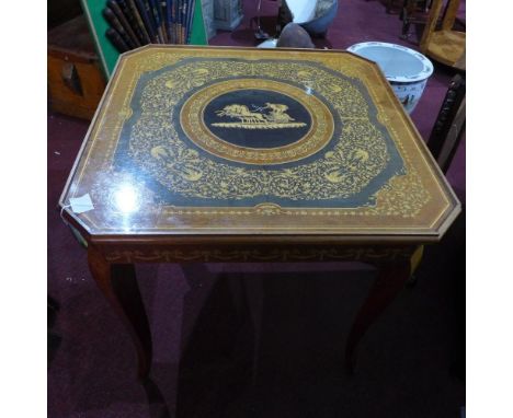 A reproduction games table with marquetry style decoration, having chess board, backgammon board, roulette board and wheel, t