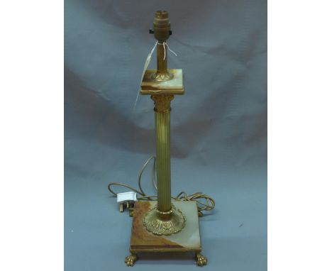 A mid 20th century brass and onyx table lamp with Corinthian column raised on paw feet, H.52cm 