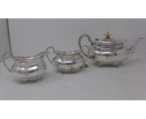 A three piece Cameron, Kilmarnock silver plated tea set, comprising a teapot with ivory finial, a twin handled sugar pot, and