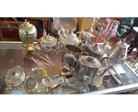 A collection of silver plated ware, to include teapots, a three sconce candelabra, serving spoons, a ladel, a pewter jug and 