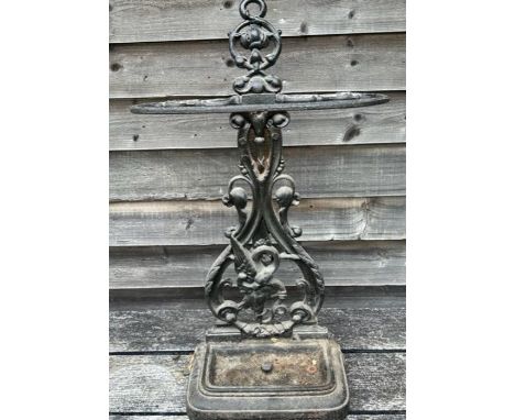 A 19th cent cast iron stick stand, registration diamond&nbsp; stamp and a collection of walking canes&nbsp;