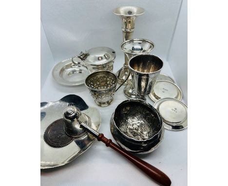 A collection of silver. Featuring a hallmarked silver lobed dish with a 1797, George III cartwheel penny; a wooden handled si