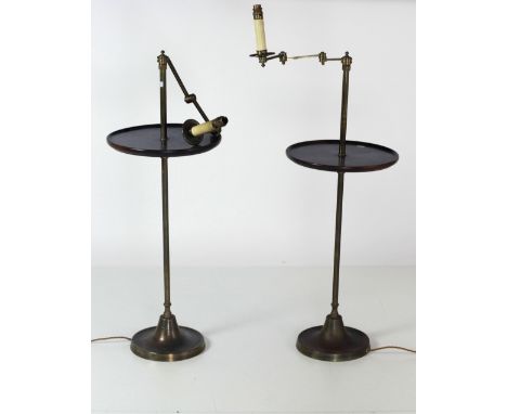 A pair of 19th Century brass Lamp Standards, with outstanding arms and circular mahogany tray, on moulded bases. (2)