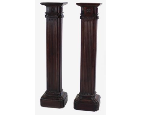 An unusual pair of tall square wooden Architectural style Plinths, decorated on all sides with ionic capitals and rosettes ov
