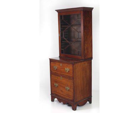 An unusual Georgian period mahogany Bookcase or Drinks Cabinet, the moulded and inlaid cornice over an astragal glazed door, 