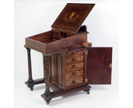 A very fine and important early 19th Century Killarney wood arbutus and marquetry Davenport Desk, the shaped raised gallery b