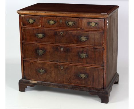 A 19th Century Queen Anne style walnut Chest, of three top and three long drawers, with decorative brass escutcheons, on plin