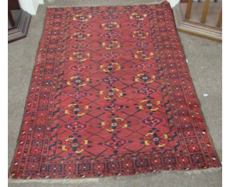 A 19th Century light woolen claret ground Carpet, with multiple floral medallion centre, approx. 5'6" x 3'8". (1)