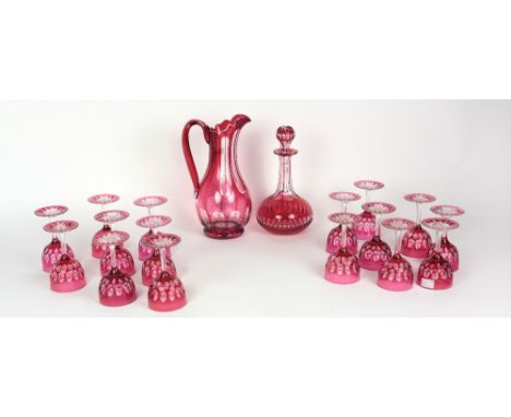 A ruby glass Decanter and stopper, together with matching jug, and 16 matching Drinking Glasses. (18)