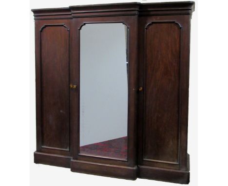 A large Victorian Irish mahogany breakfront Wardrobe, by Arthur Jones &amp; Son, Stephens Green Furnishing Company, Dublin (w