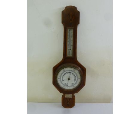 An oak cased wall barometer