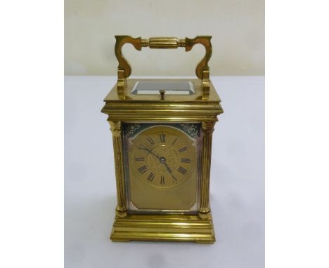 A Victorian repeating carriage clock of architectural form on stepped square base with swing handle