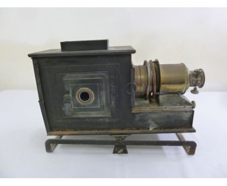 A Victorian brass and metal magic lantern on metal framed base, A/F