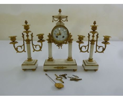 A French marble and Ormolu mantle clock set, two train movement to include keys and pendulum
