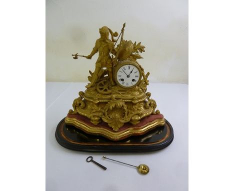A French Ormolu mantle clock, two train movement, circular enamel dial with Roman numerals, to include key and pendulum