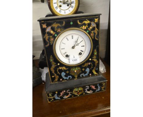 19th Century Continental buhl inlaid mantel clock, the ebonised case enclosing an enamel dial with Roman numerals and two tra