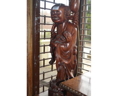 Large mid 20th Century Chinese carved hardwood lamp base in the form of a standing figure, 25ins high excluding modern fittin