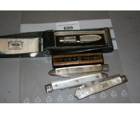 Group of five 19th Century mother of pearl and silver bladed folding fruit knives, two in original travel cases 