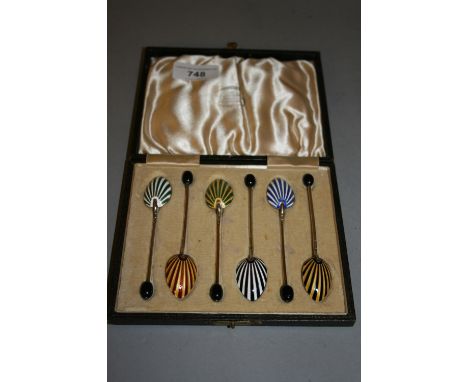 Cased set of six silver coffee spoons with enamel decorated bowls and coffee bean handles 