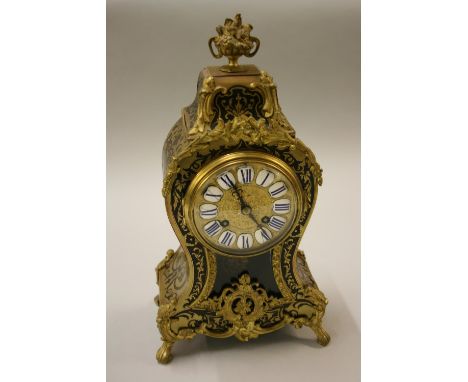 19th Century French buhl work mantel clock, the circular gilt metal dial with enamel Roman numerals and two train movement st