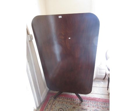 19th Century mahogany rectangular pedestal breakfast table with a tilt top above a turned column support and tripod base 