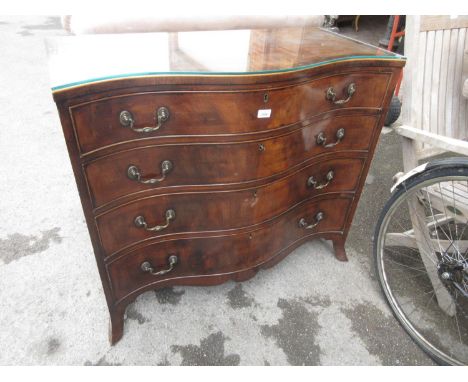 Early to mid 20th Century walnut chest of four graduated drawers, the serpentine front above splay bracket feet 