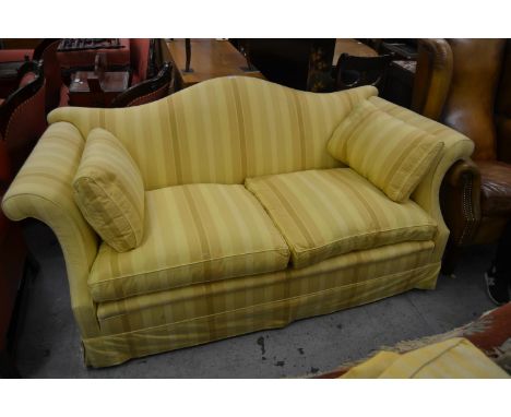 Modern Howard Chairs Ltd. Georgian style hump back sofa upholstered in yellow striped shot silk raised on six mahogany feet w