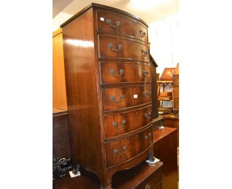 Mid 20th Century mahogany narrow bow front chest of six graduated drawers with brass handles on splay bracket feet 