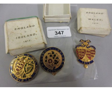 Group of three gilt metal and enamel badges, Ireland V England, England V Wales 1912 and England V Ireland 1912 