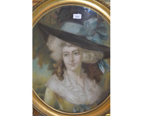 Pastel portrait of a lady wearing a wide brimmed hat, oval gilt framed together with a similar coloured print 