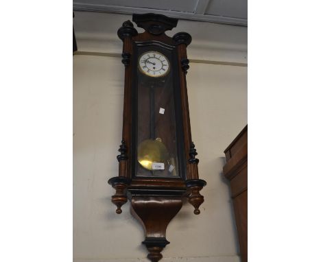 Small 19th Century and part ebonised Vienna wall clock, the enamel dial with Roman numerals, with a single train weight drive