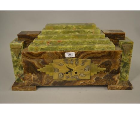 Art Deco green and brown onyx mantel clock of stepped rectangular form, the gilt dial with Arabic numerals, the two train mov