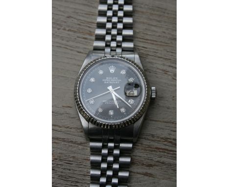 Rolex Oyster Perpetual Datejust Superlative Chronometer gentleman's stainless steel wristwatch with black dial and diamond se