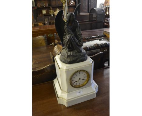 19th Century French white marble and spelter mounted mantel clock, the pillar shaped case with an enamel dial and blue Roman 