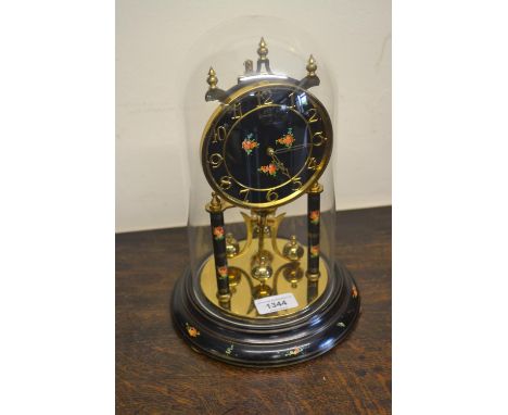 Brass and black lacquered anniversary clock under glass dome together with a walnut dome shaped mantel clock 