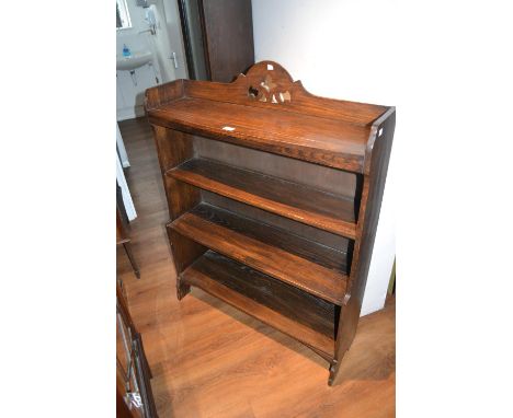 Edwardian oak three shelf open bookcase and a similar reproduction mahogany bookcase 