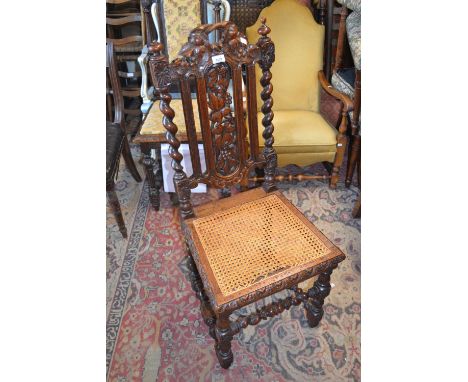 19th Century carved oak side chair with a cane seat, small oak corner stick stand, an octagonal gilt framed bevelled edge wal