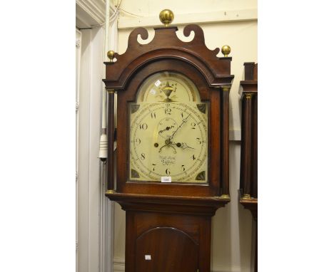 George III mahogany longcase clock with an arched hood above arched panelled door on plinth base, the painted enamel dial wit