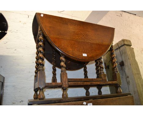 Mid 20th Century oval oak gate leg dining table on barley twist supports 