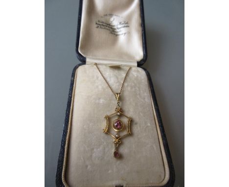 Early 20th Century 15ct gold pink topaz and split pearl pendant on a 9ct gold chain (chain at fault) 