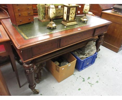 Victorian mahogany library table, the green tooled leather inset top above three frieze drawers raised on turned carved taper