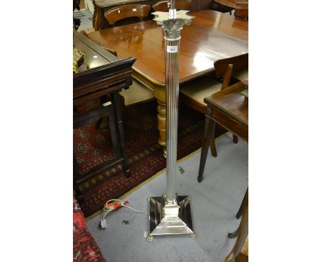 Silver plated Corinthian column standard lamp having stepped platform base with hairy paw feet, 54ins high 